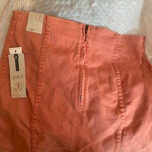 Jolt mini skirt. Never worn. New with tags. Peach colored size 3 / 26w.